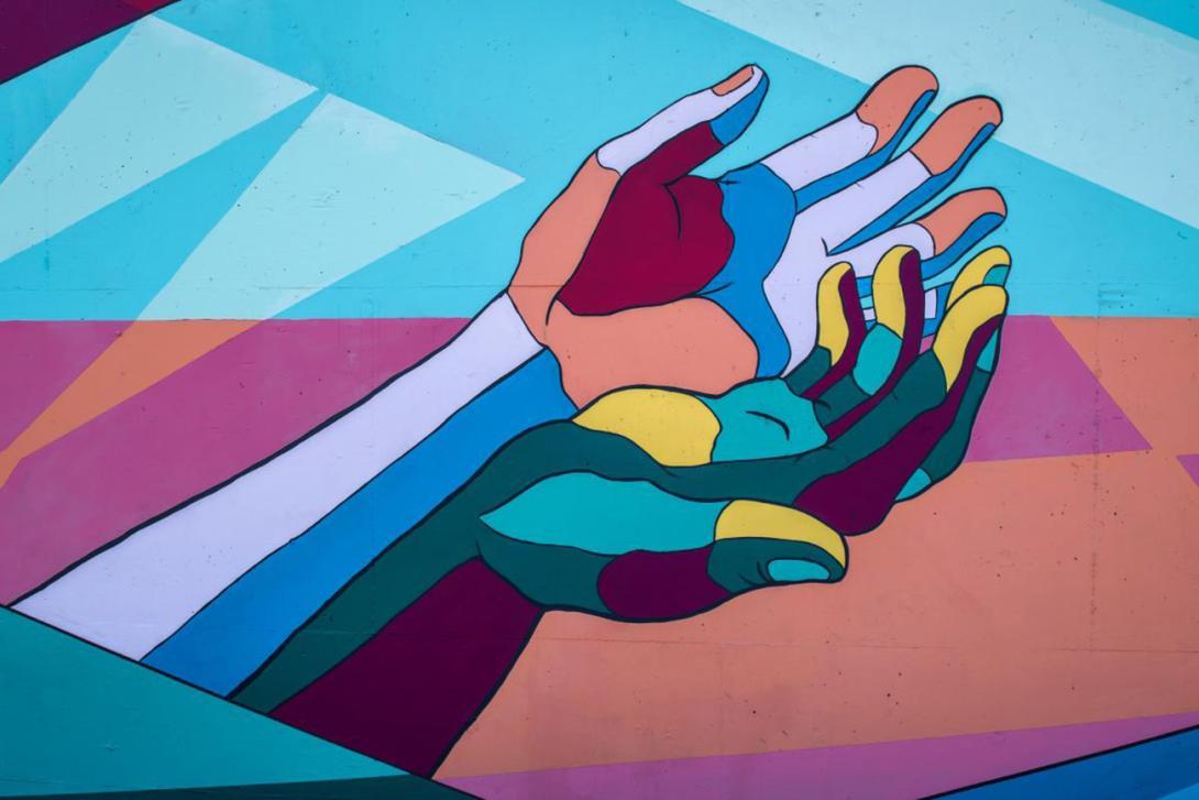 colourful illustrated graphic of cupped outstretched hands
